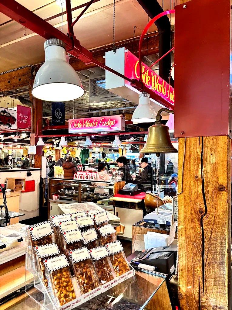 The Olde World Fudge counter in Granville Island Public Market, boxed brittle in the foreground