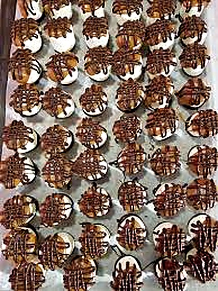 A tray of chocolate-drizzled cookies at Olde World Fudge